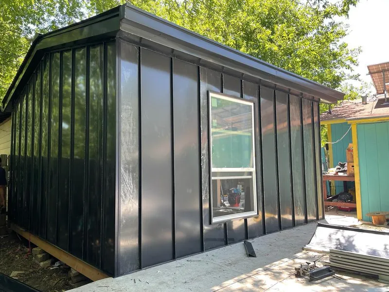 Black standing seam metal wall panels for Roof Inspection in Converse