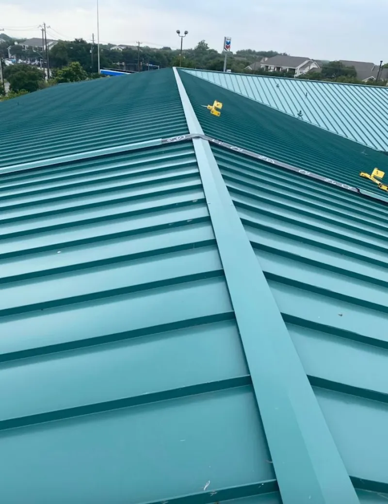 Green commercial metal roof ridge and valley for Metal Roof Repair in Converse